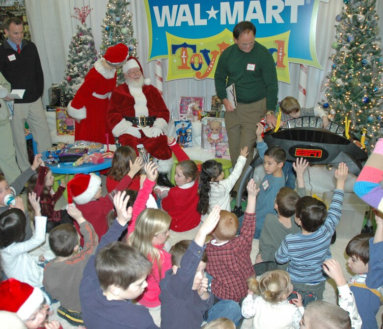 EIELSON AIR FORCE BASE -- Children from the Top of the World Toy Summit raise there hands in an oath to Santa that they will be "nice" this year. More than 30 military children served as toy testers and "ambassadors of fun" during the morning festivities. (U.S. Air Force photo by Senior Airman Justin Weaver). 