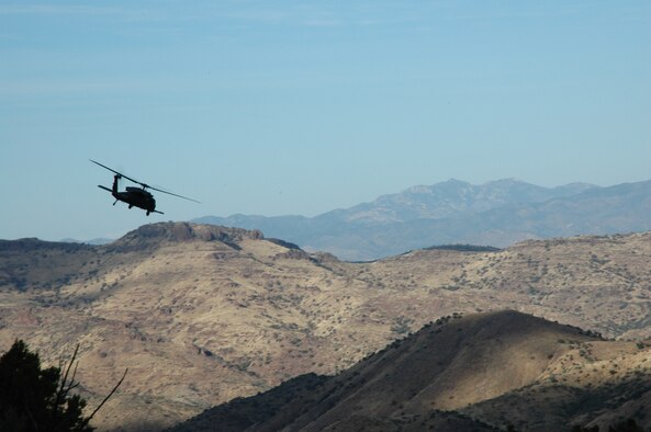 A 301st Rescue Squadron crew led by Lt. Col. Chris Hannon practices percision hovering in a mountain range near Davis-Mounthan Air Force Base, Ariz. This training will help prepare the 301st RQS to deploy in support of Operation Enduring Freedom early next year (U.S. Air Force photo/ Senior Airman Jonathan Simmons).