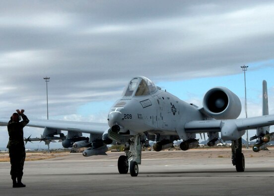A newly modified A-10C Thunderbolt II taxis in during the roll-out ceremony Nov. 29 at Davis-Monthan Air Force Base, Ariz.  The A-10 has been modified with precision engagement technology to create the new and improved A-10C.  The enhancements include full integration of sensors, multi-functional color displays and a new hands-on-throttle-and-stick interface.  (U.S. Air Force photo/Airman 1st Class Alesia Goosic)