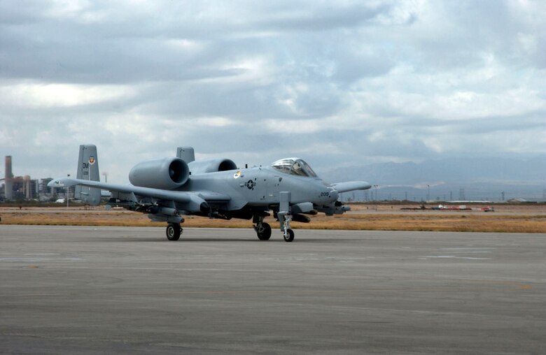 A newly modified A-10C Thunderbolt II taxis in during the roll-out ceremony Nov. 29 at Davis-Monthan Air Force Base, Ariz.  The A-10 has been modified with precision engagement technology to create the new and improved A-10C.  The enhancements include full integration of sensors, multi-functional color displays and a new hands-on-throttle-and-stick interface.  (U.S. Air Force photo/Airman 1st Class Alesia Goosic)