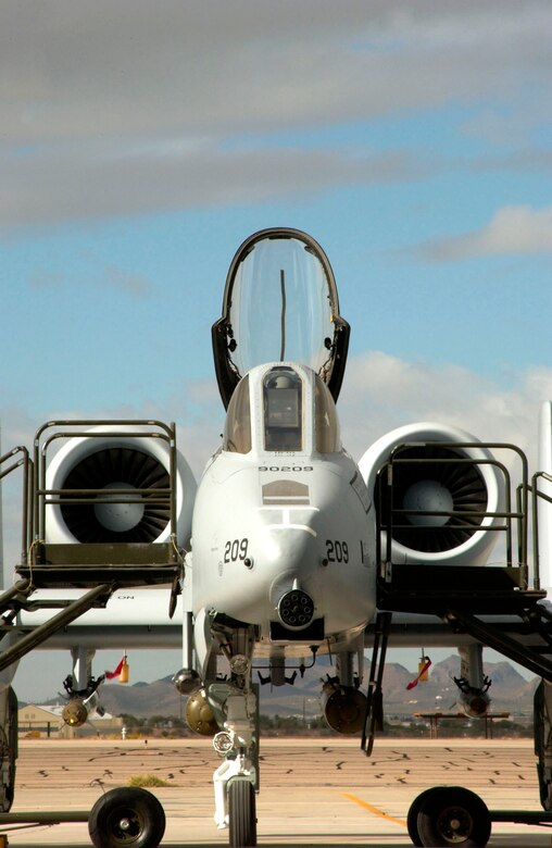 Airmen at Davis-Monthan Air Force Base, Ariz. welcome a newly modified A-10C Thunderbolt II during a roll-out ceremony Nov. 29.  The A-10 has been modified with precision engagement technology to create the new and improved A-10C.  The enhancements include full integration of sensors, multi-functional color displays and a new hands-on-throttle-and-stick interface.  (U.S. Air Force photo/Airman 1st Class Alesia Goosic)