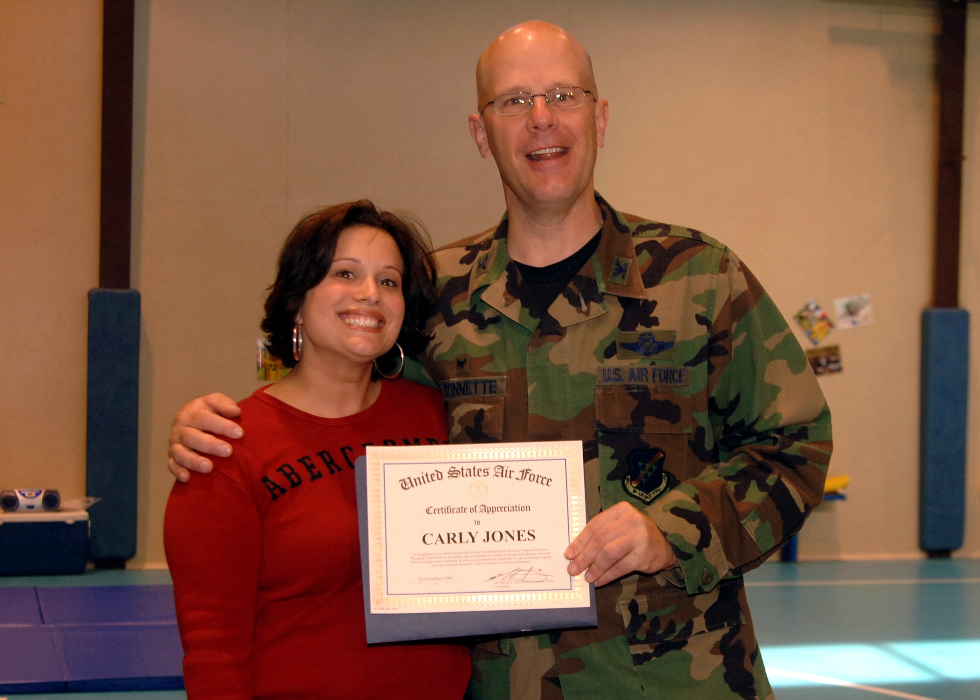 Col. Murrell "Tip" Stinnette, (right) 39th Air Base Wing commander, presents a Certificate of Appreciation to Carly Jones for her outstanding volunteer work at the Youth Center, Nov. 28. (U.S. Air Force photo by Airman Kelly L. LeGuillon) 