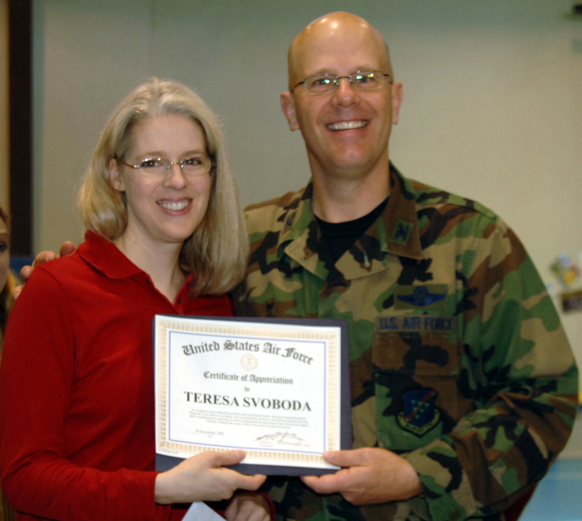 Col. Murrell "Tip" Stinnette, (right) 39th Air Base Wing commander, presents a Certificate of Appreciation to Teresa Svoboda for her outstanding volunteer work at the Youth Center, Nov. 28. (U.S. Air Force photo by Airman Kelly L. LeGuillon) 