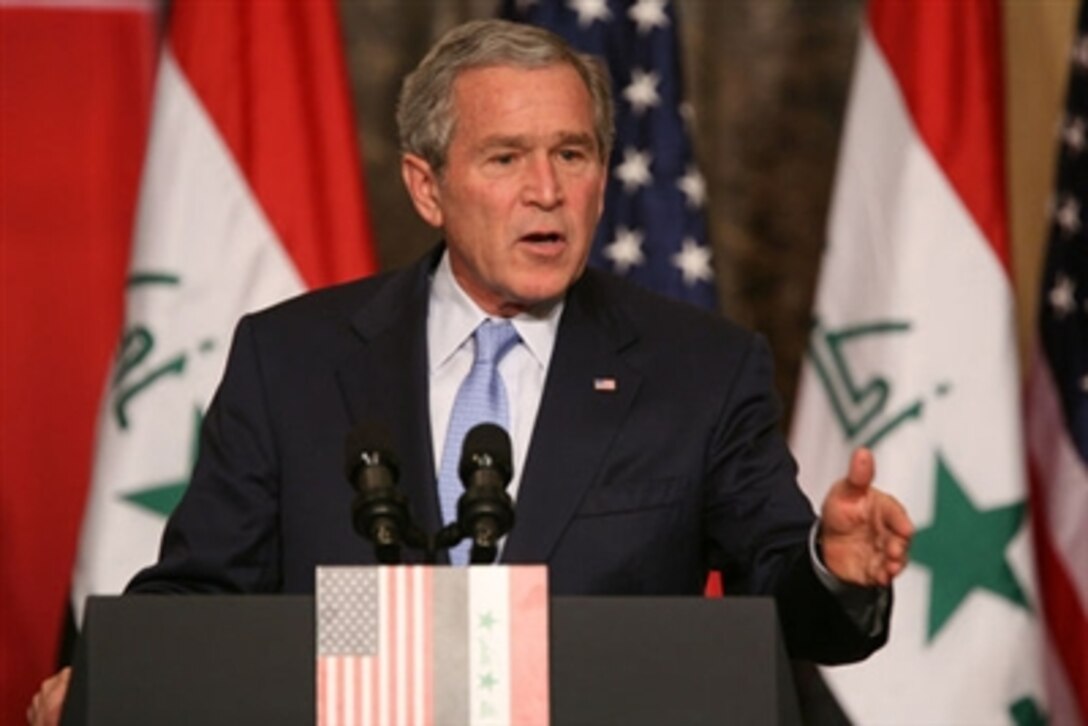 President George W. Bush responds to a question Nov. 30, 2006, during a joint press availability in Amman, Jordan, with Iraq's Prime Minister Nouri al-Maliki. 