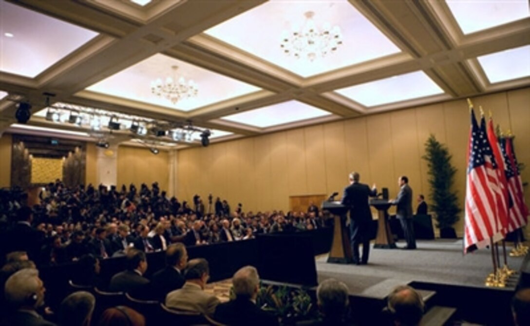 President George W. Bush and Iraqi Prime Minister Nouri al-Maliki hold a joint press availability  Nov. 30, 2006, in Amman, Jordan. The leaders later issued a statement in which they said, " We are committed to continuing to build the partnership between our two countries as we work together to strengthen a stable, democratic, and unified Iraq." 