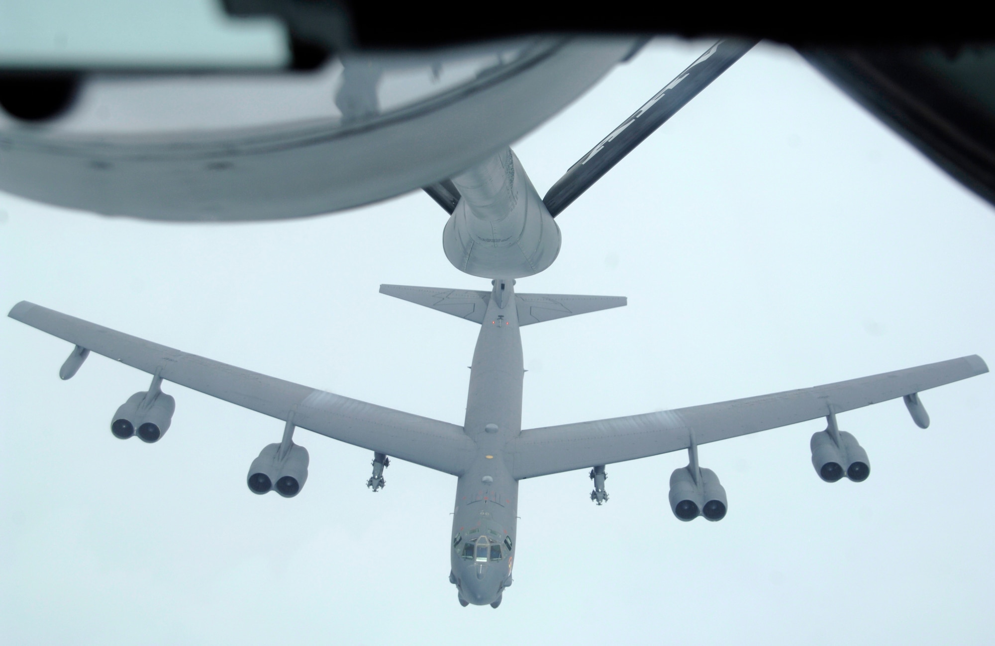 A B-52 from the 23rd Expeditionary Bomb Squadron climbs into position during a recent air refueling mission near Andersen Air Force Base, Guam.   (U.S. Air Force photo by Staff Sgt. Patrick Mitchell)