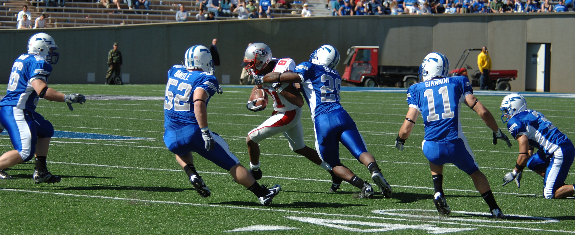 New Mexico wide receiver Travis Brown is swarmed by Air Force defenders during Sept. 30's game at Falcon Stadium. The Air Force defense held New Mexico to 273 yards of total offense in Air Force's 24-7 victory. (U.S. Air Force photo/Cadet 3rd Class Robert Mobley)