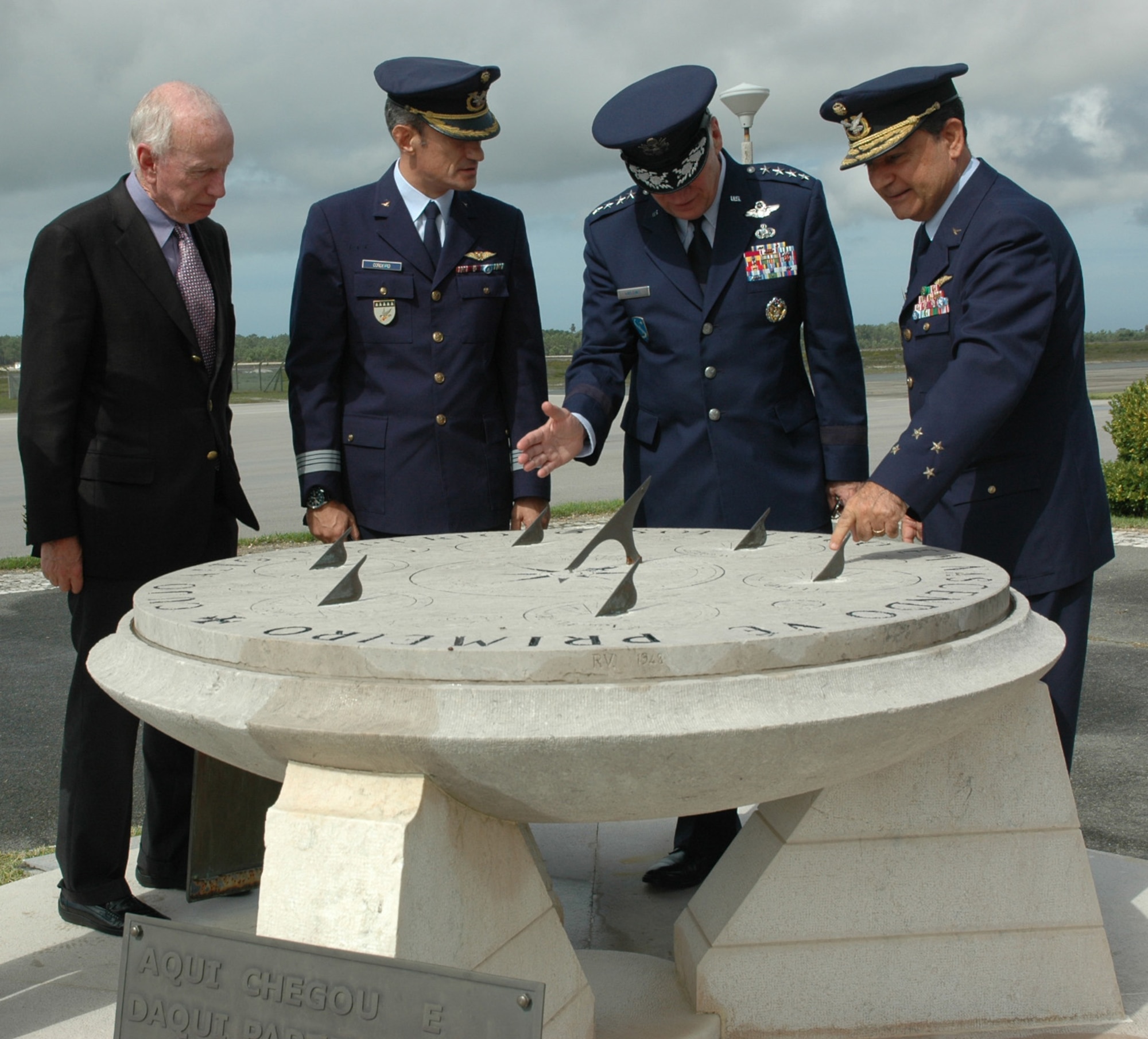 MONTE REAL AIR BASE, Portugal--Gen. Tom Hobbins (second from right), U.S. Air Forces in Europe commander, examines a sundial monument below the air traffic control tower here with Portuguese General Manuel Jose Taveira Martins (right), Portuguese Air Force Chief of Staff, U.S. Ambassador to Portugal Alfred Hoffman (left), and Portuguese Colonel Joao Luis Ramirez de Carvalho Cordeiro, Monte Real Air Base commander, Sep. 29. (U.S. Air Force Photo/Capt. Elizabeth Culbertson)