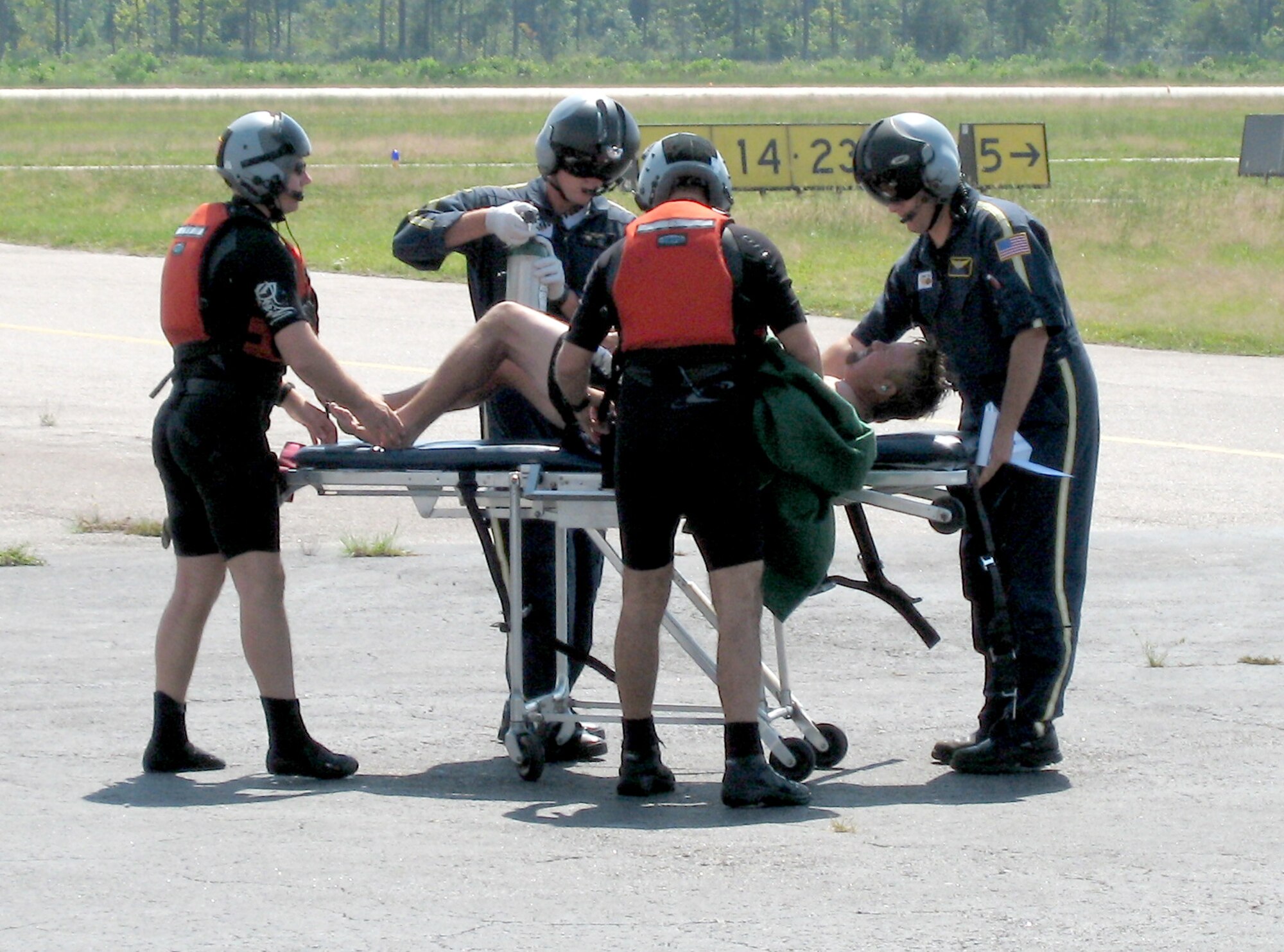 Air Force Reserve Pararescuemen MSgt. Chad Evans and Staff Sgt. Joel Corbett, of the 308th Rescue Squadron, transload a boater who they rescued 15 miles off the coast of Jacksonville, Fla. Oct. 1 to a Life Flight team for further treatment.