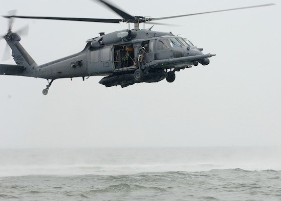 A rescue crew from the 347th Rescue Group at Moody Air Force Base, Ga., test a "Kangaroo Duck" in the Gulf of Mexico off the coast of Apalachicola, Fla. The K-Duck is an inflatable raft that is strapped to the underbelly of a rescue helicopter so it can be easily dropped to better assist with water-rescue scenarios like those experienced during Hurricane Katrina.  (U.S. Air Force photo/Airman 1st Class Schelli Jones)