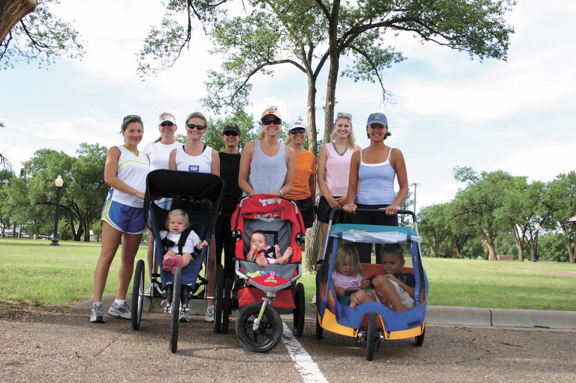CANNON AIR FORCE BASE, N.M. -- From left to right: Jenyphr Goldsberry,Tracey Hansen, Amy Gallemore, Sam Daniel, Kristen Cockrum, Stephanie Wolf, Stephanie Bolton and Andrea Ross, get ready to go for a walk as they prepare for the Breast Cancer ‘3-Day event,’ Oct. 27-29, in Dallas. Each member has pledged at least $2,000 for research and awareness programs. For information on how to pledge support  for the walk, call 784-4228. (U.S,. Air Force photo by Greg Allen)
