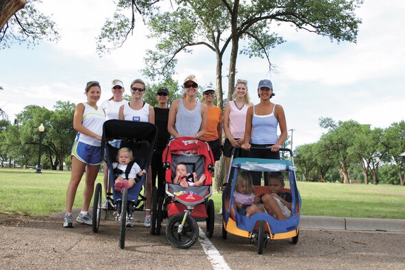 CANNON AIR FORCE BASE, N.M. -- From left to right: Jenyphr Goldsberry,Tracey Hansen, Amy Gallemore, Sam Daniel, Kristen Cockrum, Stephanie Wolf, Stephanie Bolton and Andrea Ross, get ready to go for a walk as they prepare for the Breast Cancer ‘3-Day event,’ Oct. 27-29, in Dallas. Each member has pledged at least $2,000 for research and awareness programs. For information on how to pledge support  for the walk, call 784-4228. (U.S,. Air Force photo by Greg Allen)
