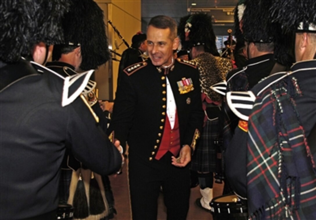 Chairman of the Joint Chiefs of Staff U.S. Marine Corps Gen. Peter Pace greets the Boston Police bagpipers at the 2006 Congressional Medal of Honor Society Convention Committee in Boston, Mass., Sept. 30, 2006. 