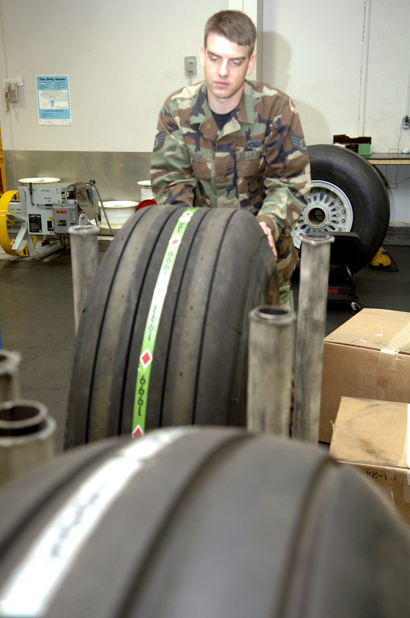 Staff Sgt. Joseph Kokesh checks the tire inventory in the 92nd Maintenance Squadron's wheel and tire shop for KC-135 Stratotankers. An Air Force Smart Operations 21 initiative is under way in the shop to eliminate almost half of the current tire stock. The reduction should result in a significant cost avoidance for the Air Force. (U.S. Air Force photo/Senior Airman Chad Watkins)