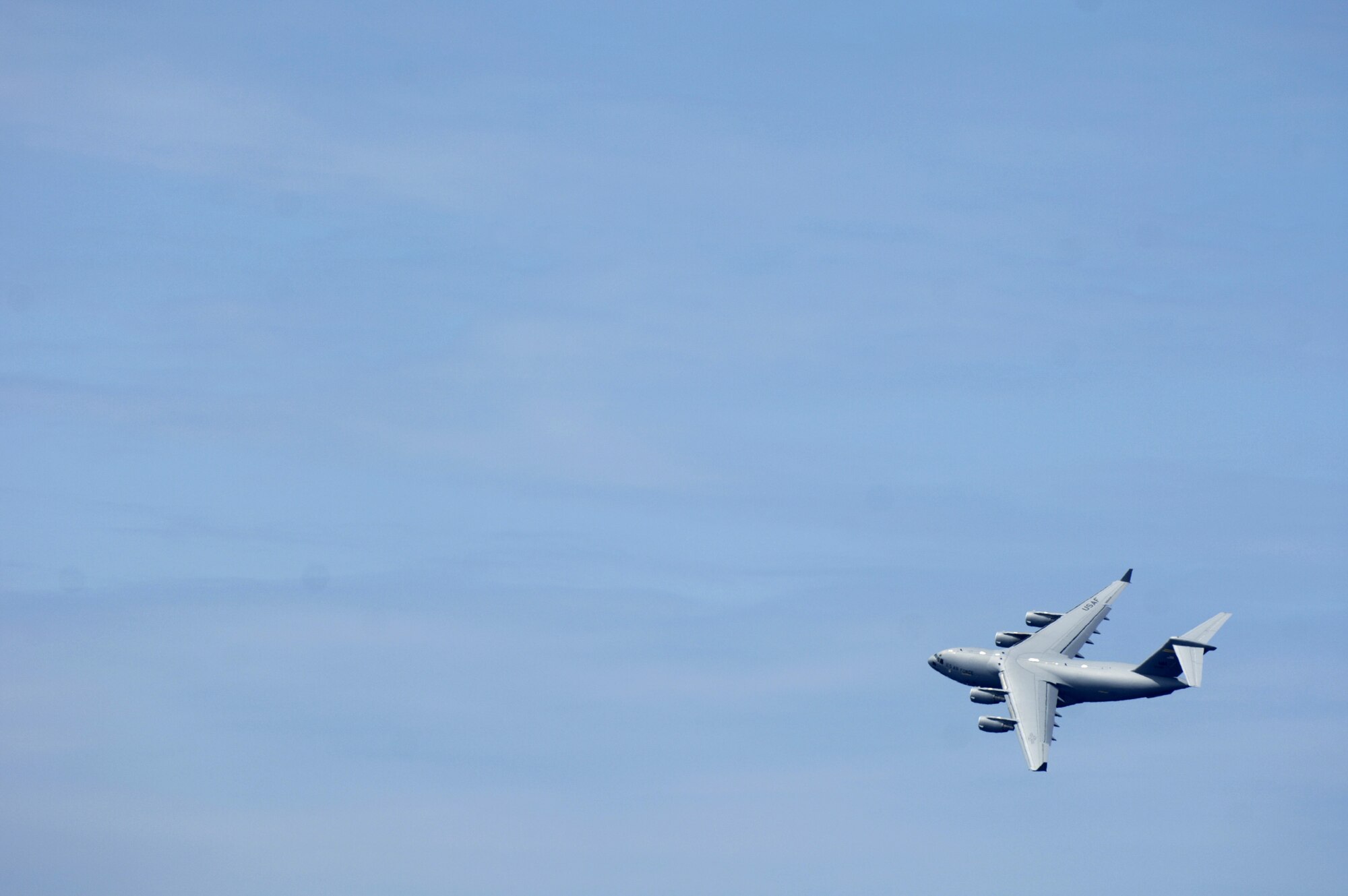 A C-17 Globemaster III practices aerial maneuvers Sept. 27 over Kona International Airport in Hawaii to prepare for an upcoming air show. The C-17 is from the 535th Airlift Squadron based at Hickam Air Force Base, Hawaii. (U.S. Air Force photo/Tech. Sgt. Shane A. Cuomo) 
