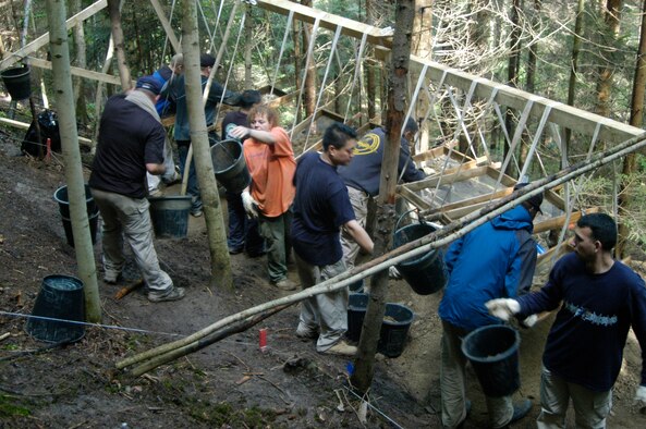 An 18-member team from the Joint POW/MIA Accounting Command works together excavating a crash site near Vostenhof, Austria, on Aug. 13. The team, including a forensic anthropologist, explosive ordnance disposal technician and field medic, are deployed from Hickam Air Force Base, Hawaii, returned Oct. 1 after 45 days in Austria attempting to recover the remains of 1st Lt. Stanley Dwyer and gunner Sgt. John Boros who were lost in the crash May 10, 1944. The mission of JPAC is to achieve the fullest possible accounting of all Americans missing as a result of the nation's past conflicts. (U.S. Air Force photo/Staff Sgt. Derrick C. Goode)