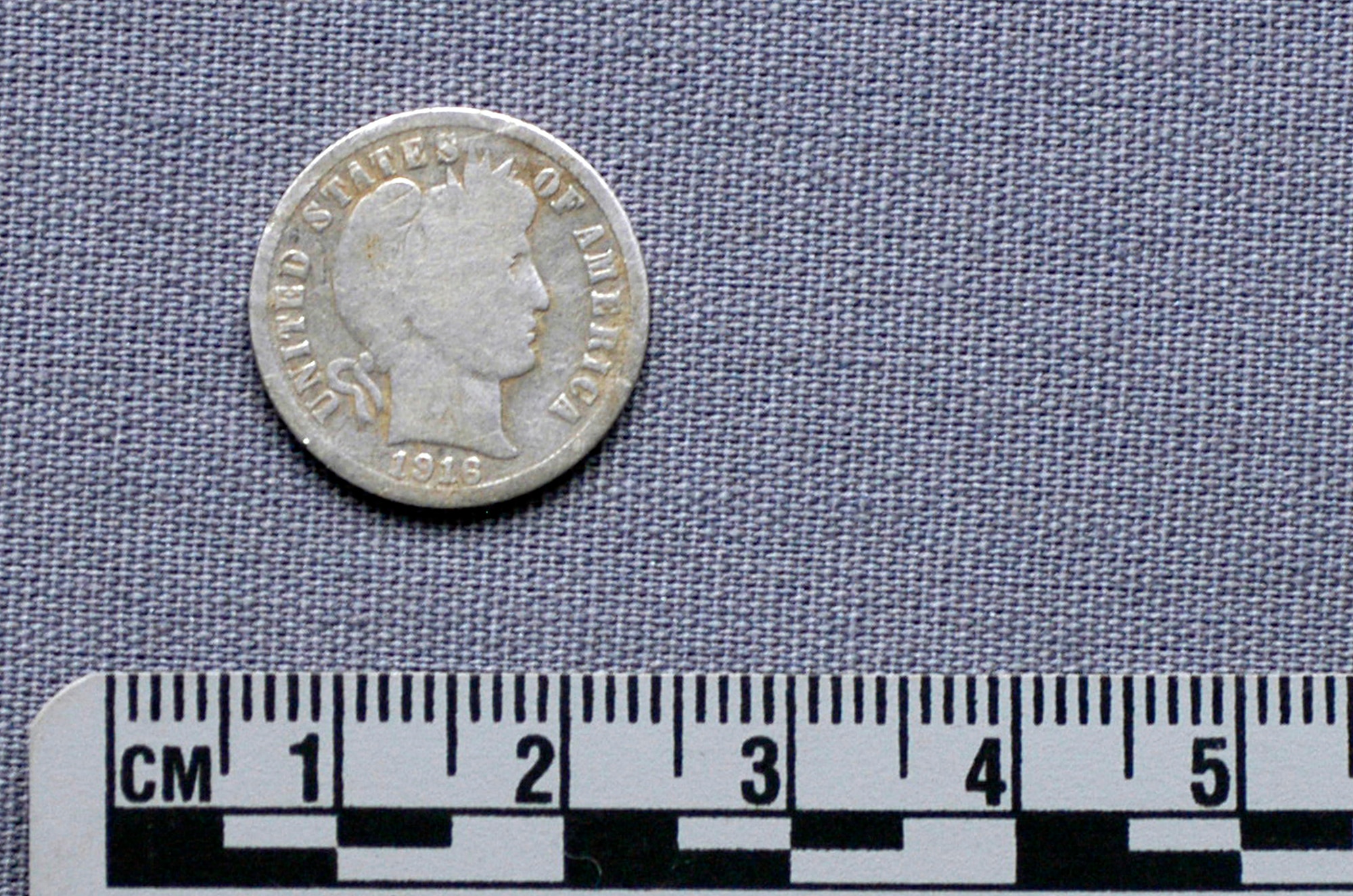 A 1916 silver dime is recovered at the site of a B-17 bomber crash near Vostenhof, Austria, on Aug. 7. The dime is significant because the pilot, 1st Lt. Stanley Dwyer, was born in 1916 and it is believed by his family that he may have been carrying the dime as a good luck charm on the day of the crash. An 18-member JPAC team, including a forensic anthropologist, explosive ordnance disposal technician and field medic, from Hickam Air Force Base, Hawaii, returned Oct. 1 after 45 days in Austria attempting to recover the remains of 1st Lt. Stanley Dwyer and gunner Sgt. John Boros who were lost in the crash May 10, 1944. The mission of JPAC is to achieve the fullest possible accounting of all Americans missing as a result of the nation's past conflicts. (U.S. Air Force photo/Staff Sgt. Derrick C. Goode) 