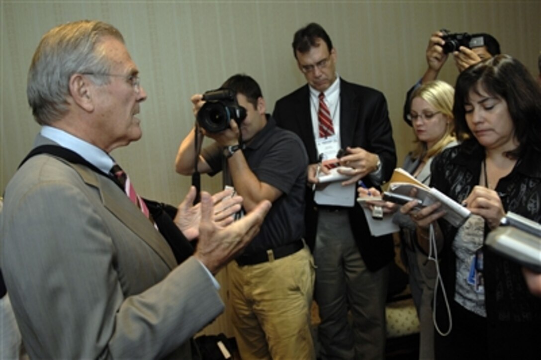 Secretary of Defense Donald H. Rumsfeld (left) responds to a reporter's question during a press conference in Managua, Nicaragua, on Oct. 2, 2006.  Rumsfeld is in Nicaragua attending the Conference of Ministers of Defense of the Americas plenary session to promote defense and security cooperation among western hemisphere countries.  