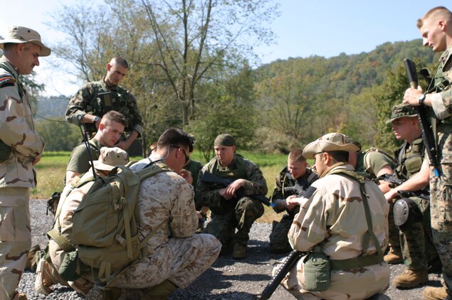 CAMP DAWSON, WEST VIRGINA ? (October 6, 2006)? An instructor with Team-4 briefs Marines with Marine Corps Barracks 8th and I during a patrolling package part of FMTU?s ORE. Teams-4 and-6 completed their final exercise with the help of the Marines and contracted linguists as role players for the event. (Official U.S. Marine Corps Photo by Cpl. Ken Melton)
