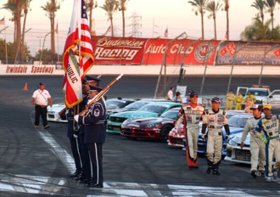 Cutline:  Members from the Blue Eagles Total Force Honor Guard at March Air Reserve Base prepare to present the colors during the opening ceremonies at a recent drifting event at the Irwindale Speedway which was co-sponsored by the Air Force Reserve Command. The event featured some of the best professional drifters in D1 taking on some of NASCAR’s brightest stars, including Kasey Kahne, Matt Kenseth, Bill Elliott, Greg Biffle, Robby Gordon and Casey Mears, in a drifting exhibition. (U.S. Air Force photo by Mr. Erickson Barnes, 452 AMW/PA)
 
