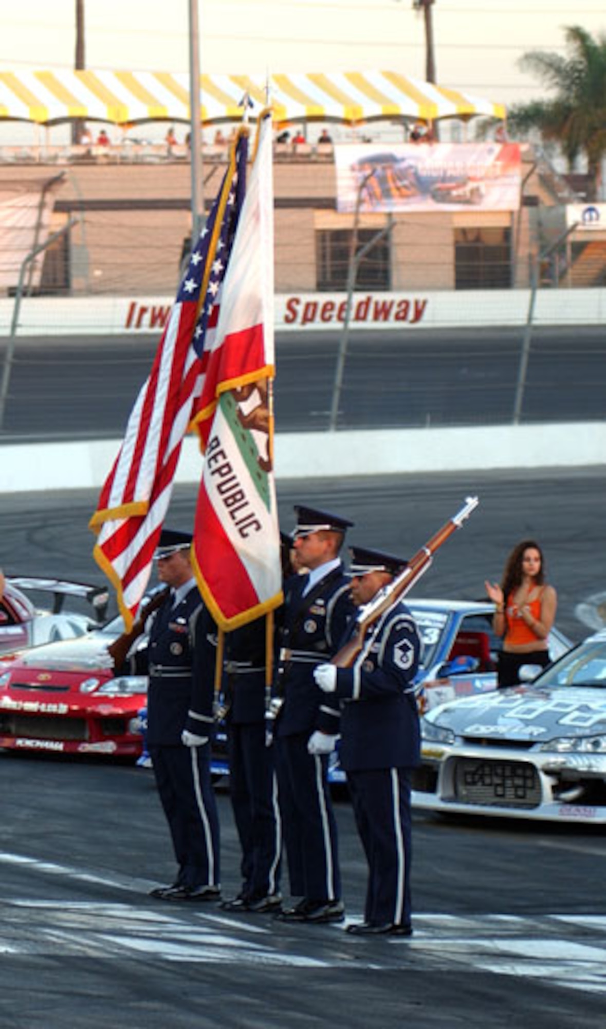 Members from the Blue Eagles Total Force Honor Guard at March Air Reserve Base prepare to present the colors during the opening ceremonies at a drifting event at the Irwindale Speedway which was co-sponsored by the Air Force Reserve Command.  The event featured some of the best professional drifters in D1 taking on some of NASCAR’s brightest stars, including Kasey Kahne, Matt Kenseth, Bill Elliott, Greg Biffle, Robby Gordon and Casey Mears, in a drifting exhibition.  (U.S. Air Force photo by Mr. Erickson Barnes, 452 AMW/PA)