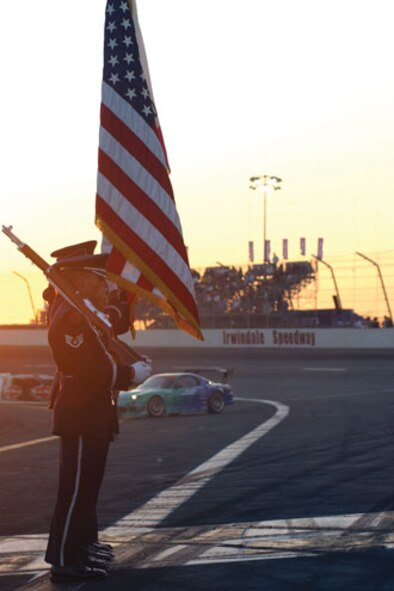 Members from the Blue Eagles Total Force Honor Guard at March Air Reserve Base prepare to present the colors during the opening ceremonies at a drifting event at the Irwindale Speedway which was co-sponsored by the Air Force Reserve Command.  The event featured some of the best professional drifters in D1 taking on some of NASCAR’s brightest stars, including Kasey Kahne, Matt Kenseth, Bill Elliott, Greg Biffle, Robby Gordon and Casey Mears, in a drifting exhibition.  (U.S. Air Force photo by Mr. Erickson Barnes, 452AMW/PA)