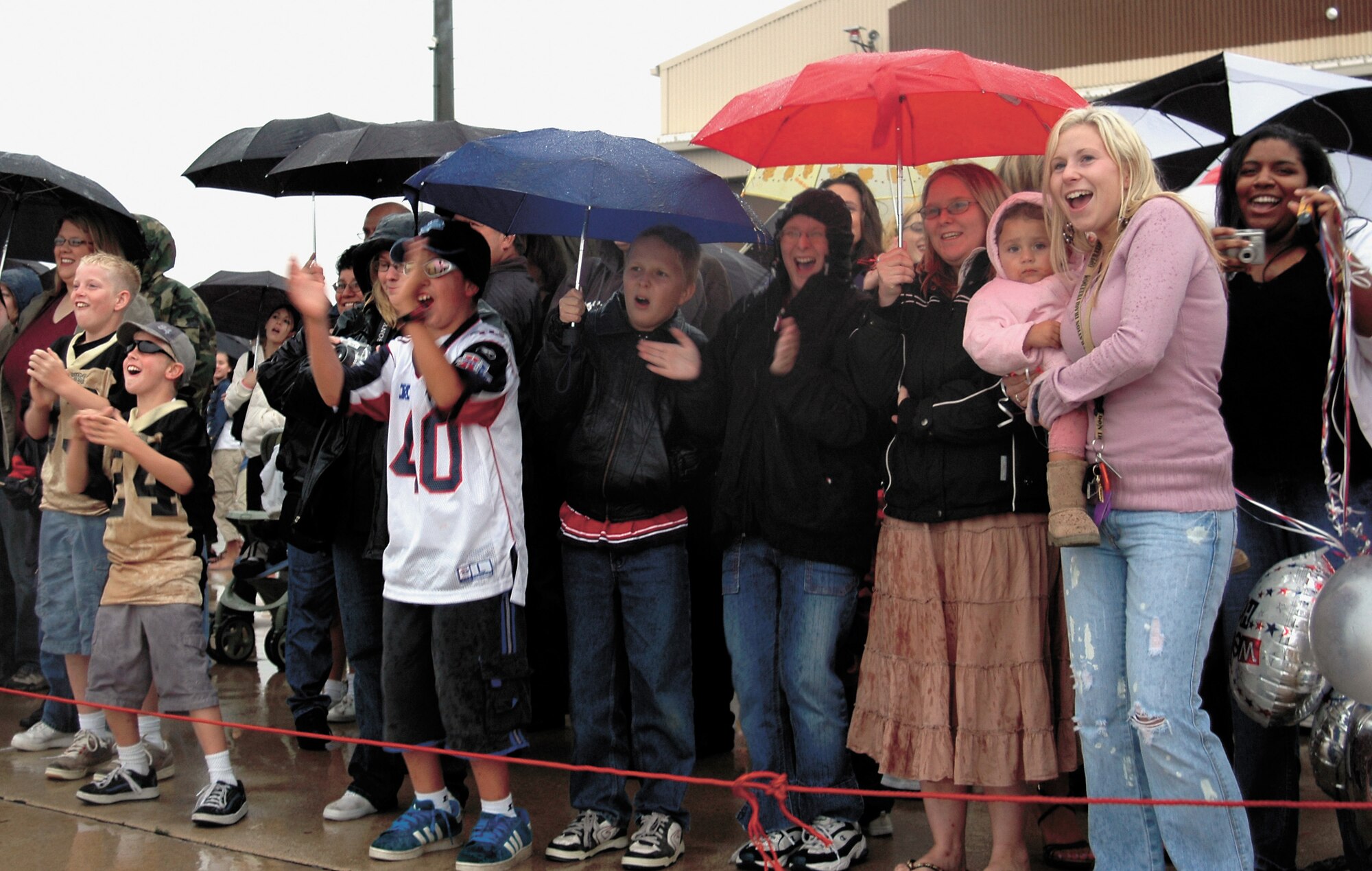 Family and friends cheer as the commercial airline carrying 421st EFS Airmen pulls up to Hangar 37 Friday at about 4 p.m. 