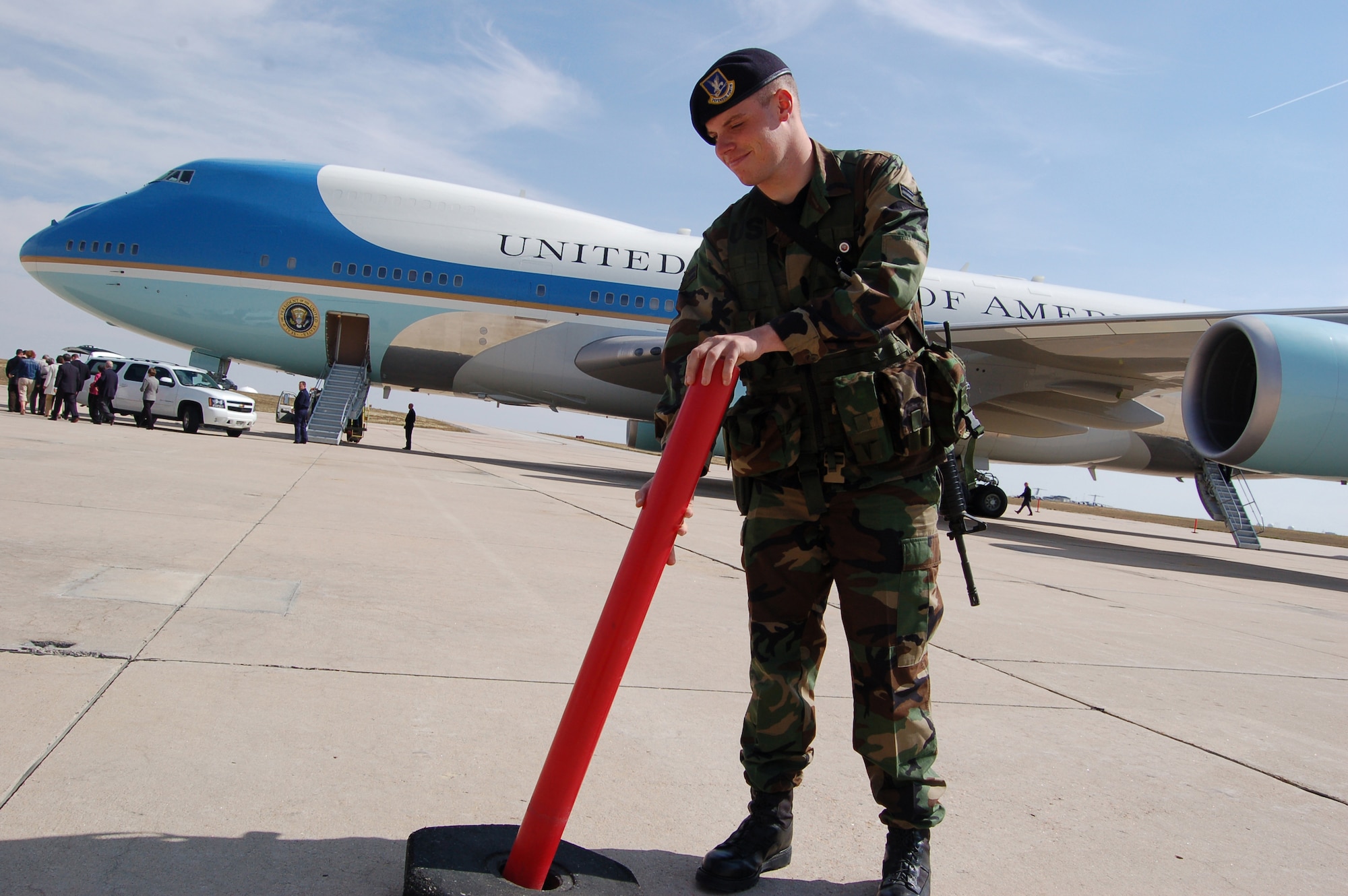 BUCKLEY AIR FORCE BASE, Colo. -- Airman 1st Class Zach Ahern, from the 140th Security Forces Squadron, sets up a perimeter around Air Force One after President George W. Bush landed at Buckley Air Force Base, Colo., on his way to speak at a fundraiser for a fellow Republican's gubernatorial campaign. (U.S. Air Force photo by Senior Airman Jacque Lickteig) 