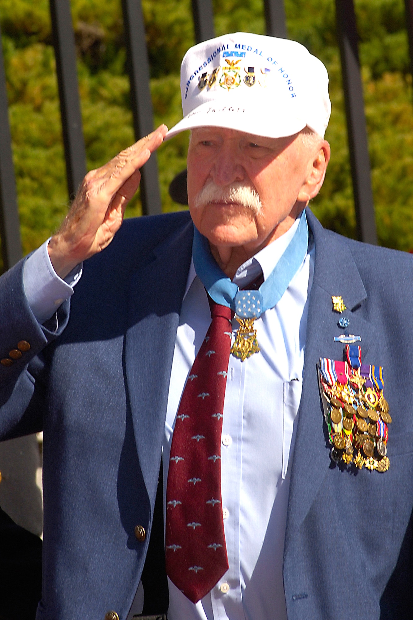 Retired Army Col. Lewis Millett offers a salute during a special ceremony Sept. 27 at the State House in Boston.  The ceremony honored more than 70 Medal of Honor recipients in Boston for their annual convention.  Colonel Millett, who was a captain at the time, received the Medal of the Honor in 1951 for leading an uphill bayonet charge against enemy forces during the Korean War. (U.S. Air Force photo/Jan Abate) 