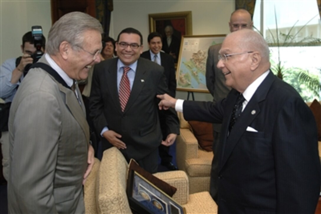 Defense Secretary Donald H. Rumsfeld, left, speaks with Nicaraguan Minister of Defense Avil Ramirez, center, and Nicaraguan President Enrique Bolanos Geyer at the presidential office in Managua, Nicaragua, Oct. 3, 2006. 