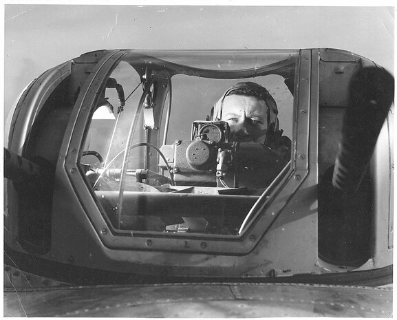 99th Bombardment Group upper turret gunner checks his sights