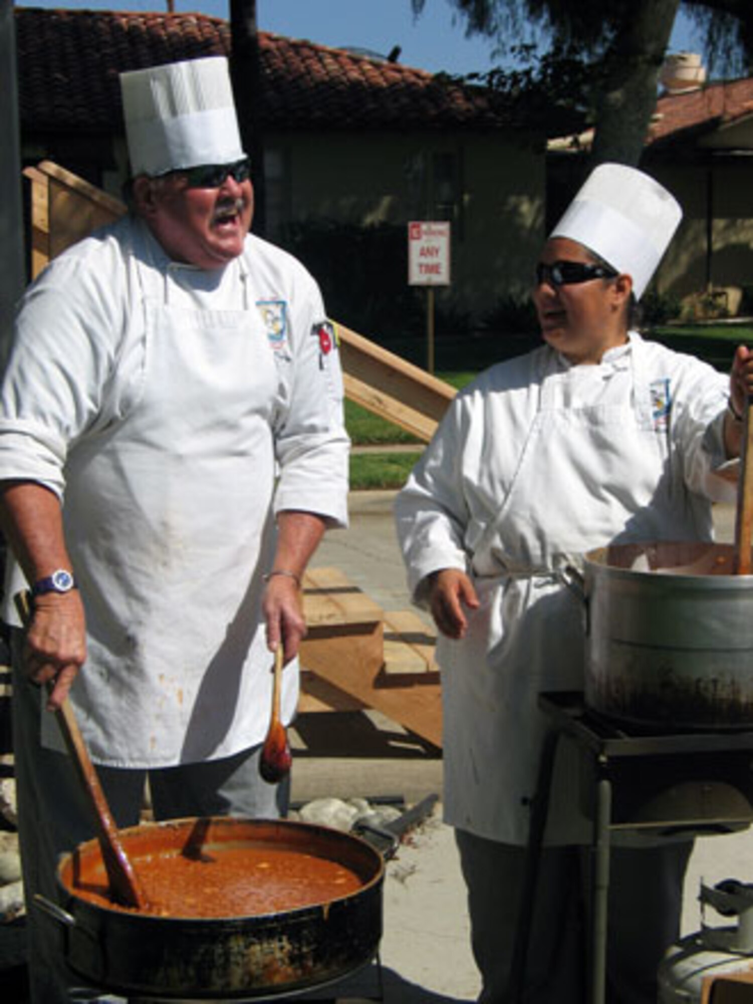 Two cooks from the Riverside Culinary School prepare the food during the annual base wide picnic held on Saturday, September 16. The local communities of Riverside and Moreno Valley organized and funded the picnic to show their appreciation to the military members who work at the base. More than 5,000 military members and their families attended the event. This is the 34th appreciate day picnic the community has hosted for March Air Reserve Base. (U.S. Air Force photo by MSgt Carson Hampton)
