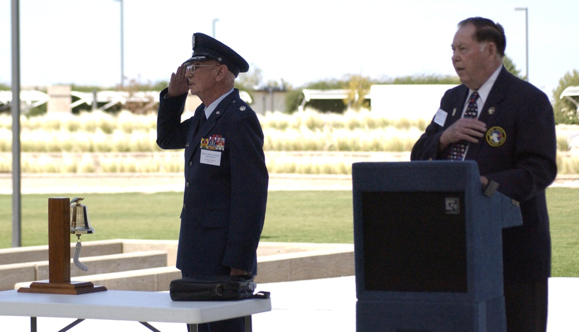 Retired Lt. Col. James Spatafora and Earl Moore, the president of the Berlin Airlift Veterans Association, recite the pledge of allegiance during the Berlin Airlift plaque dedication at Veterans Memorial Park in Albuquerque, N.M., Oct. 4. There were more than 150 attendees at the dedication. (U.S. Air Force Photo/Staff Sgt. Jeremy Larlee)