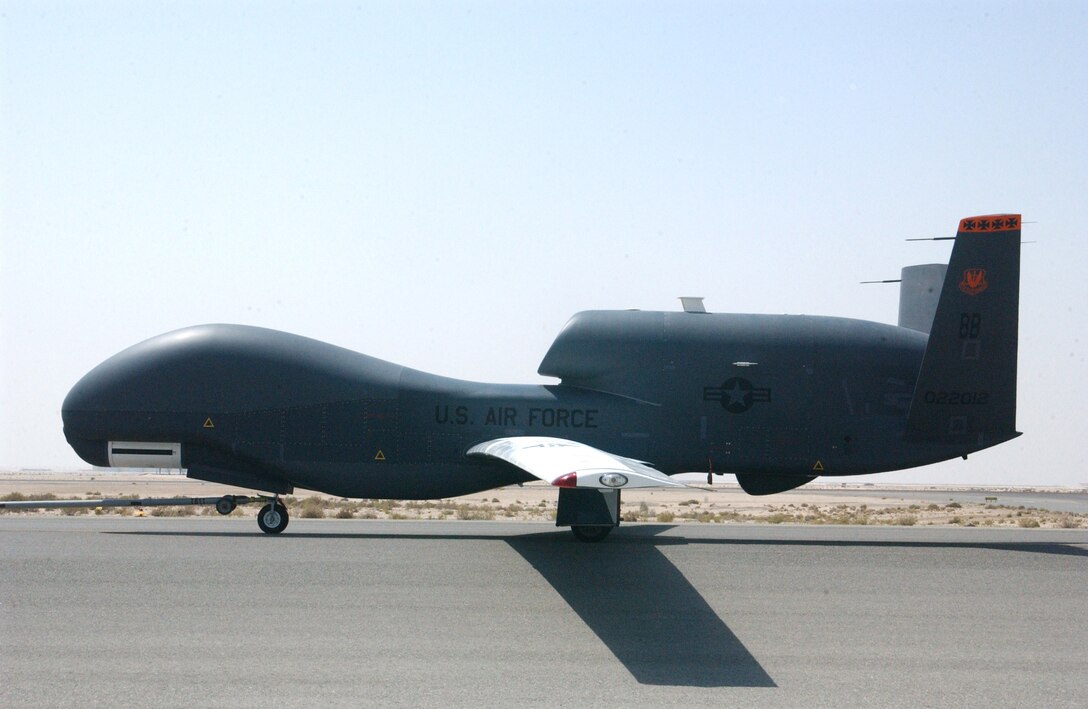 A Global Hawk unmanned aircraft system is towed back to its hangar following a mission Oct. 3 at a deployed location in Southwest Asia. Once mission parameters are programmed into a Global Hawk, the UAS can autonomously taxi, take off, fly, remain on station capturing imagery, return and land. Ground-based operators monitor the UAS's status, and can change navigation and sensor plans during flight as necessary. (U.S. Air Force photo/Master Sgt. Jason Tudor)