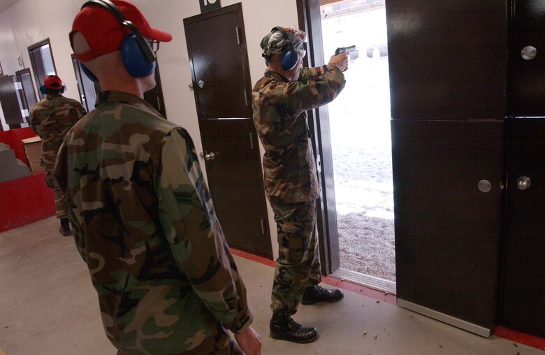 Capt. Tim Paget, 490th Missile Squadron, fires an M-9 pistol at the live-fire range during Line Swine events Sept. 29.