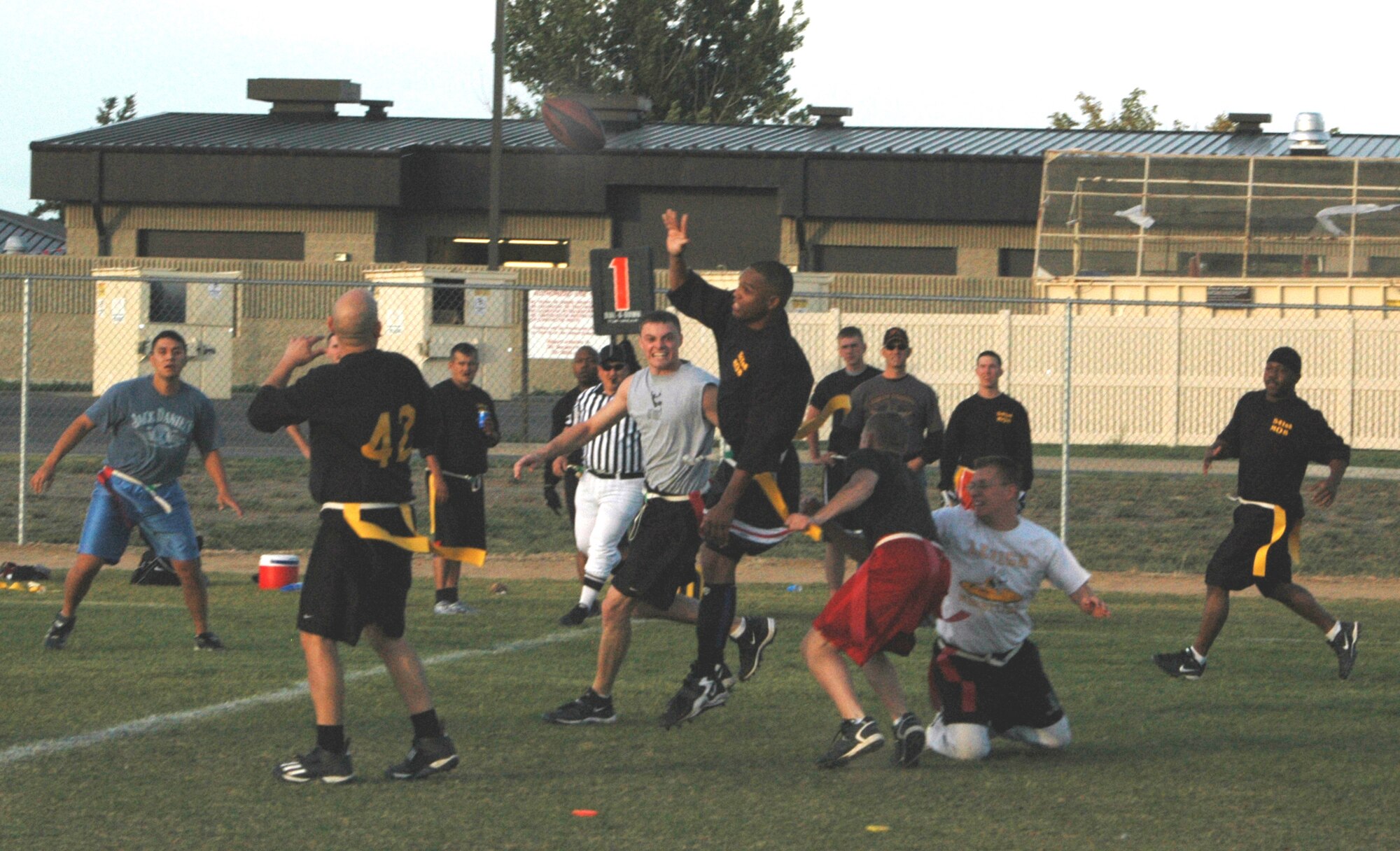 The 341st Maintenance Operations Squadron squeezes by the 341st Missile Maintenance Squadron in the last games of the flag football championships Sept. 28. MOS took the championship after MMXS gave them a scare, winning the first game, 21 to 6. MOS came back in the second game by one point, winning 13 to 12. 
