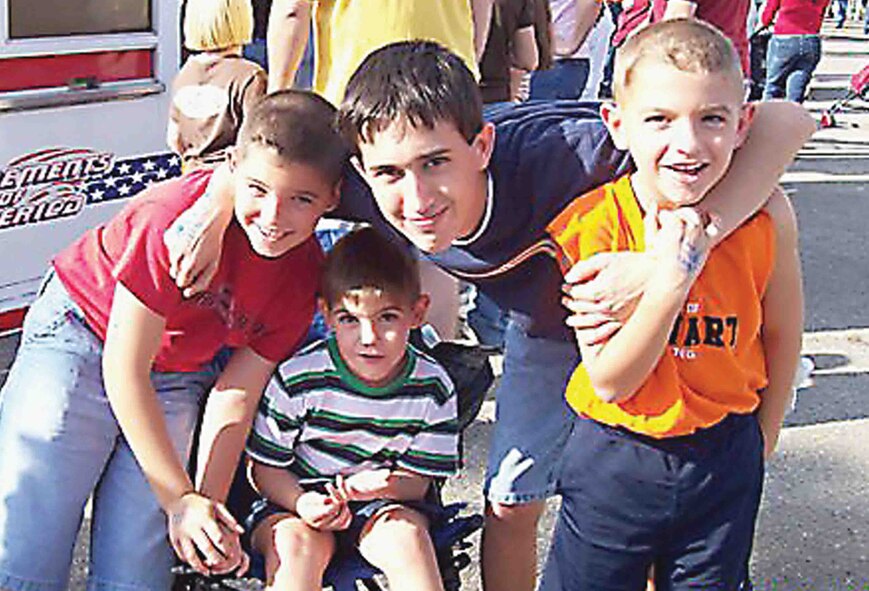Jonathan (left), Aaron (lower center) and Evan (right) Barber enjoy the day at the Sumter fair with their cousin Andrew (top center). U.S. Air Force photo/Danielle Barber)