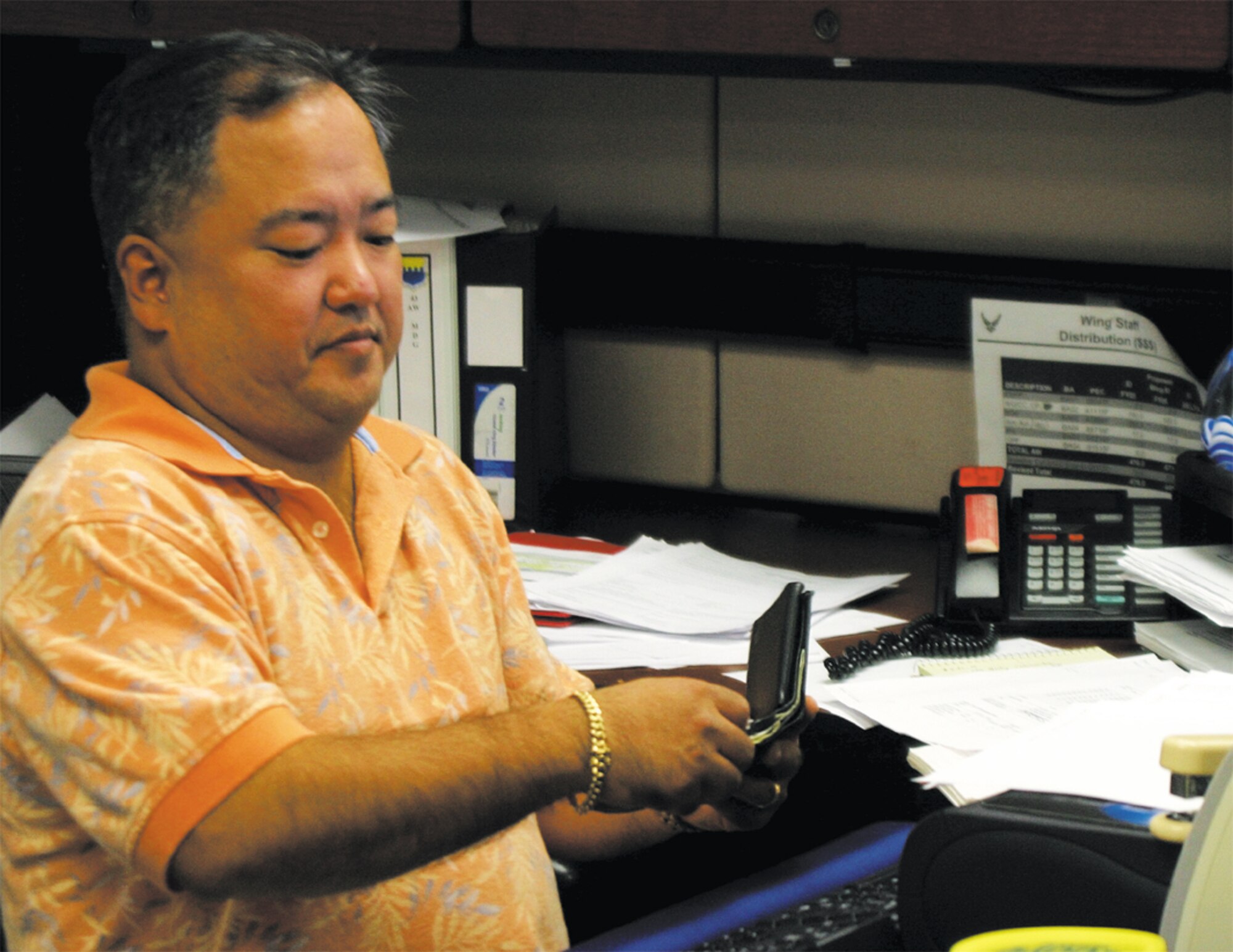 Master Sgt. Harold Nakamoto, 43rd Comptroller Squadron, oversees the final purchases before Fiscal Year 2006 closed out Sept. 30. Members from Team Pope were burning the midnight oil during the last days of FY06 to ensure PopeÕs budget was accurate. (U.S. Air Force photo/1st Lt. Lisa Ferguson)