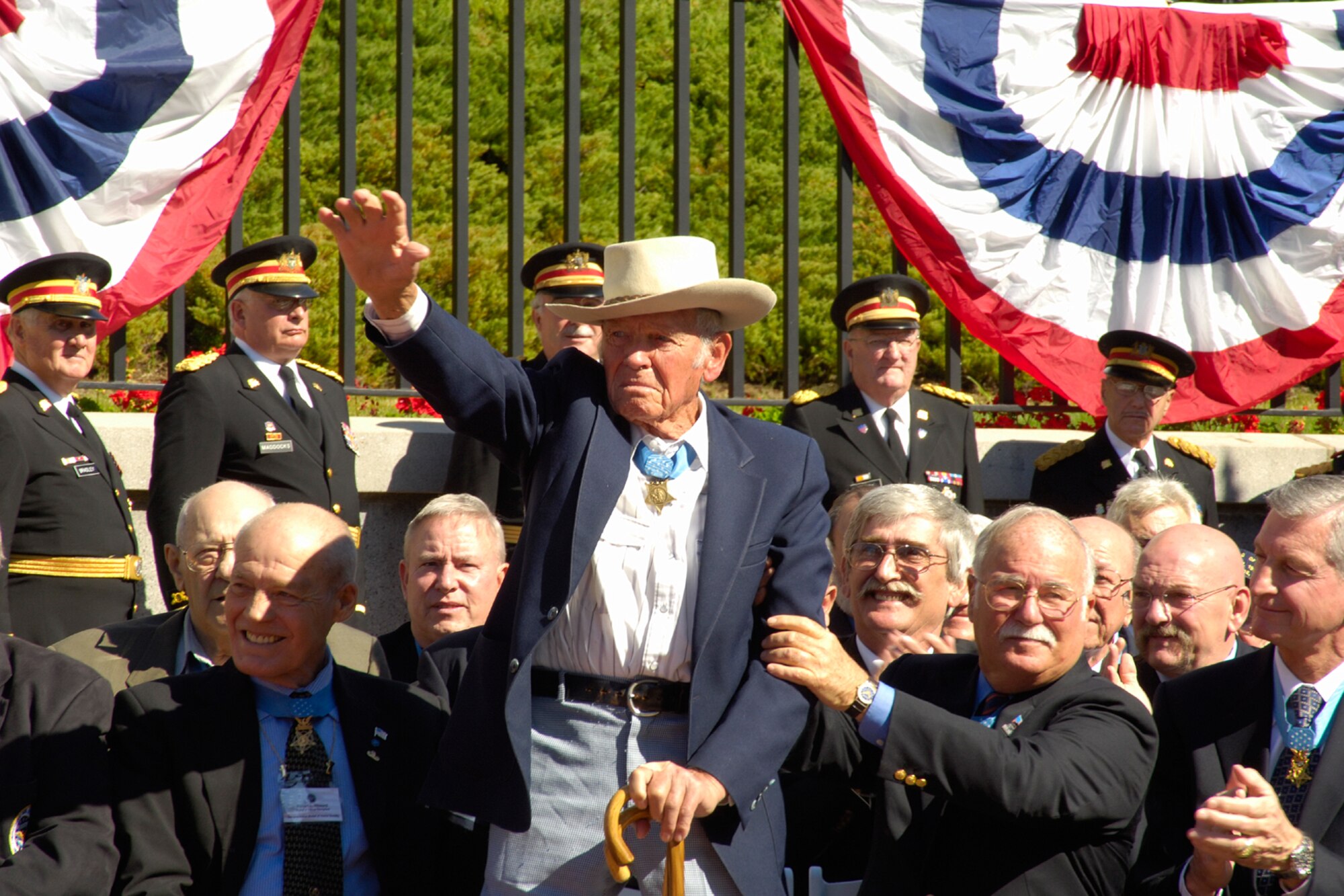 BOSTON — John L. Finn stands and acknowledges those in attendance. At age 96, Mr. Finn is the oldest living Medal of Honor recipient, It has been nearly 65 years since he earned his medal while defending the Kaneohe Bay Naval Air Station during the first attack on Pearl Harbor on Dec. 7, 1941. (Air Force photo by Jan Abate)