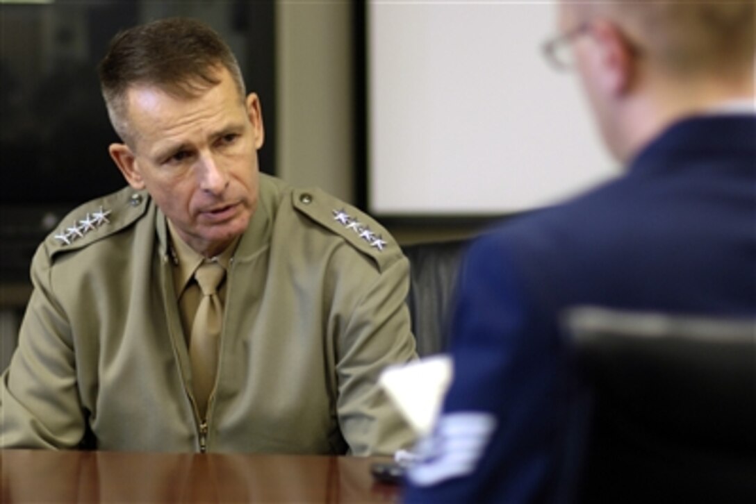 U.S. Marine Corps Gen. Peter Pace, chairman of the Joint Chiefs of Staff, answers questions from a staff writer at the Kirtland Air Force Base newspaper prior to speaking to approximately 700 airmen stationed at Kirtland, N.M., Oct. 4, 2006. 