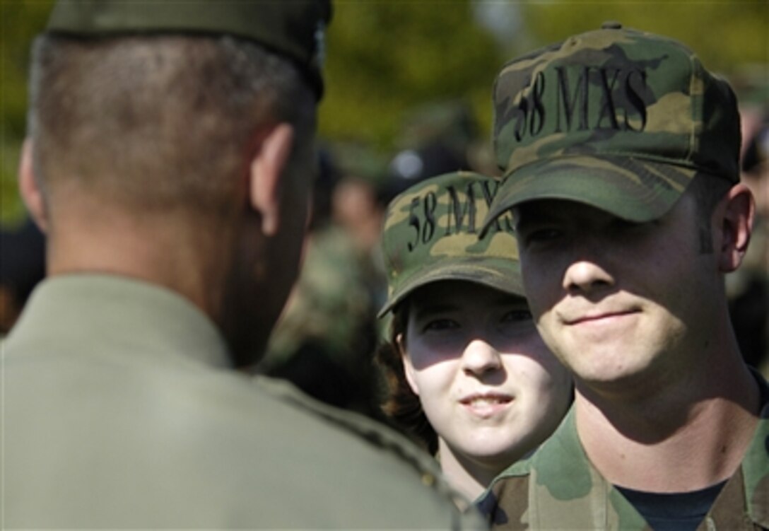 U.S. Marine Corps Gen. Peter Pace, chairman of the Joint Chiefs of Staff, greets approximately 700 airmen after speaking and addressing their questions at Kirtland Air Force Base, N.M., Oct. 4, 2006. 