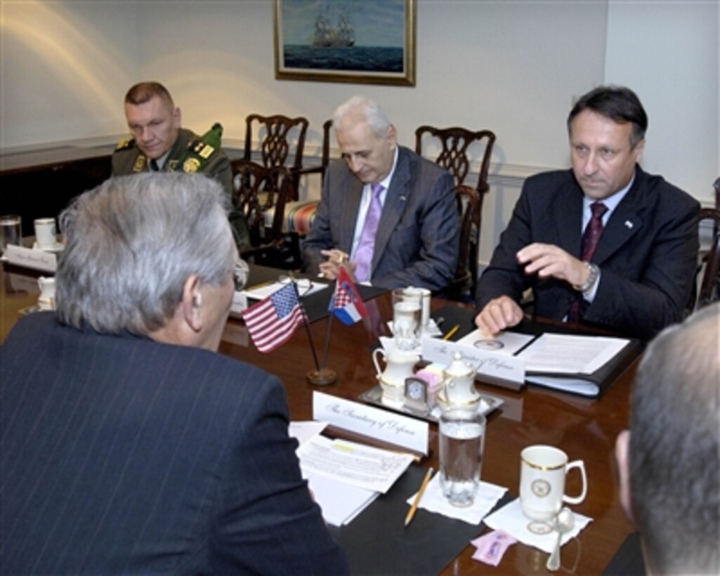 Croatian Minister of Defense Berislav Roncevic (right) meets with Secretary of Defense Donald H. Rumsfeld (left) in the Pentagon on Oct. 5, 2006.  Under discussion are various global and regional security issues of mutual interest to both nations.  Also participating in the talks are Director of the Croatian Military Security Agency Maj. Gen. Gordan Cacic (far left) and Croatian Ambassador H. E.  Neven Jurica (center).  