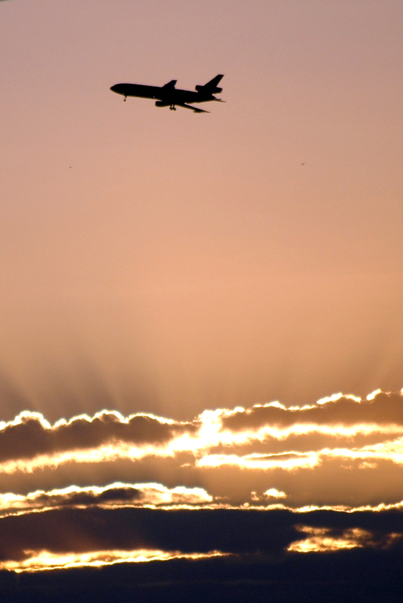 A KC-10 Extender refueling aircraft from the 305th Air Mobility Wing at McGuire Air Force Base, N.J., flies over the base on its way back from a mission Oct. 3.  The KC-10 is one of the Air Force's main refuelers.  (U.S. Air Force photo/Tech. Sgt. Scott T. Sturkol)