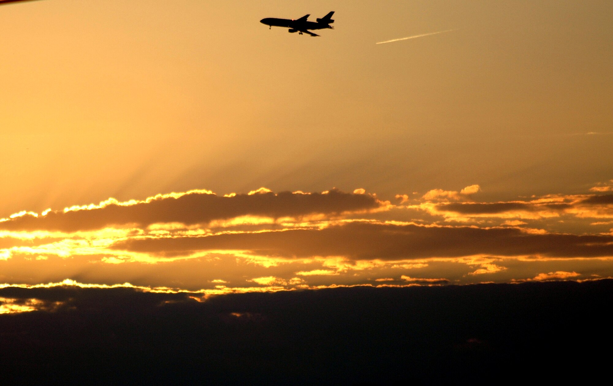 A KC-10 Extender refueling aircraft from the 305th Air Mobility Wing at McGuire Air Force Base, N.J., flies over the base on its way back from a mission Oct. 3.  The KC-10 is one of the Air Force's main refuelers.  (U.S. Air Force photo/Tech. Sgt. Scott T. Sturkol)
