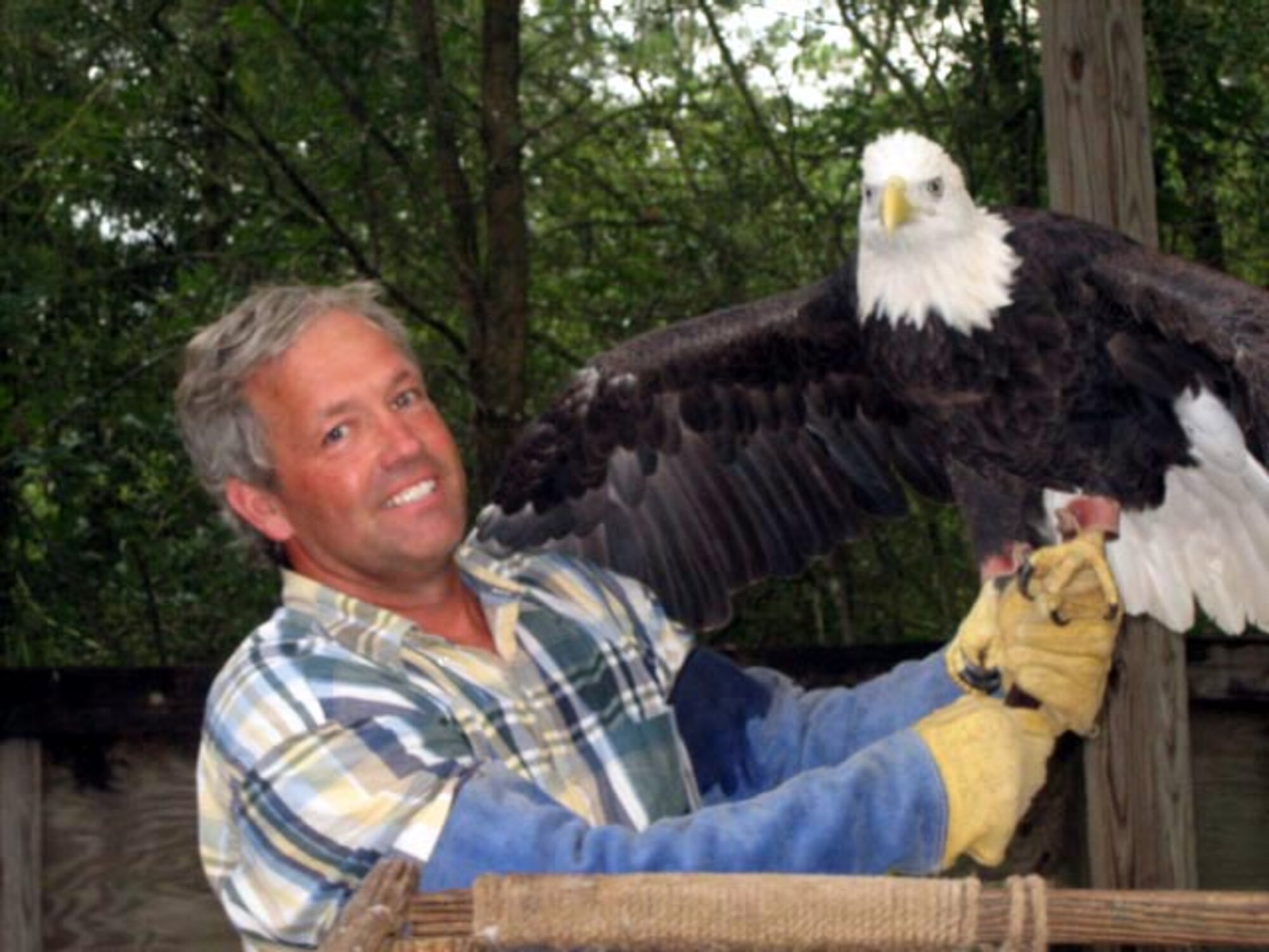 Jim Hartwell, 605th Test and Evaluation Squadron, holds an American Bald Eagle at the Big Bend Sanctuary.  He was recently awarded the NPS Award. (Courtesy Photo)