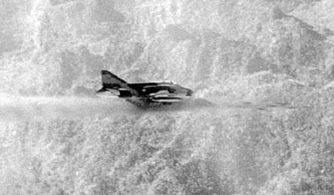 McDonnell Douglas F-4C in flight firing a salvo of 2.75 FFA rockets in the mountains of North Vietnam in April 1966. (U.S. Air Force photo)
