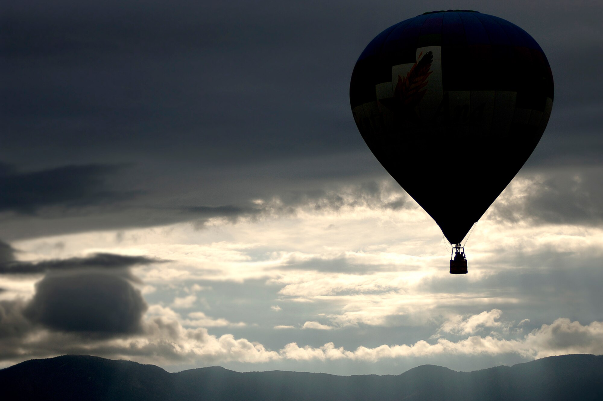 One of over 700 hot air balloons took off for the first mass ascension over Fiesta Park during the Balloon Fiesta at Albuqerque, New Mexico, Oct. 7, 2006.   Balloon Fiesta is a world-renowned New Mexico attraction where several hot air balloons have been flying for thirty five years.  (US Air Force photo/Tech Sgt. Cecilio Ricardo Jr.)