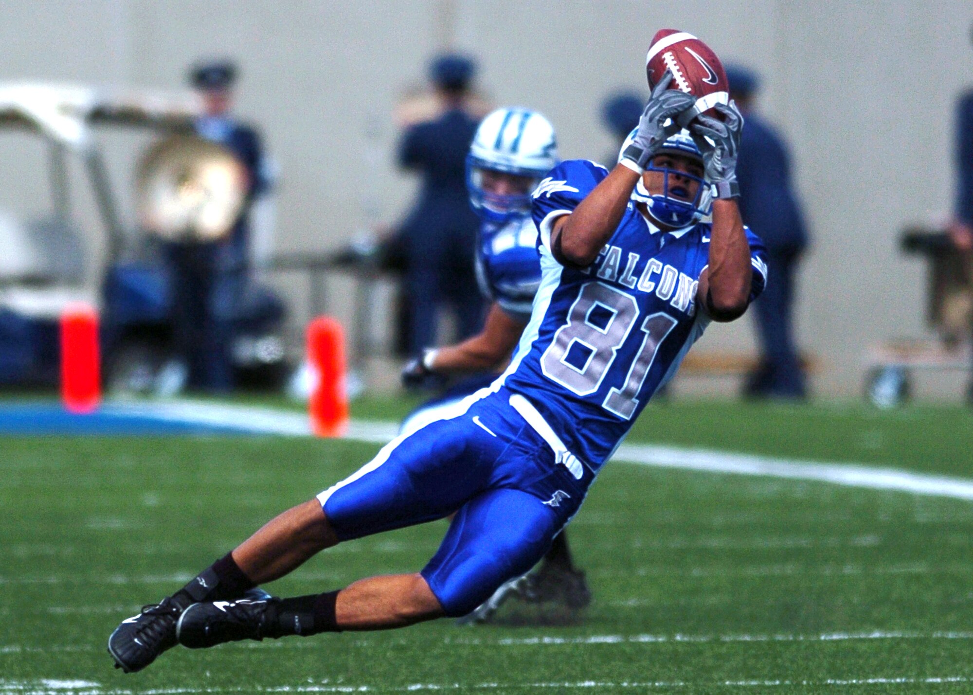 Air Force wide receiver Victor Thompson goes airborne Saturday to bring down a third quarter pass from quarterback Shaun Carney. The Falcons’ 119 total passing yards was not enough to ensure a win over Navy.  Navy won, 24-17.   (Photo by 1st Lt. John Ross)
