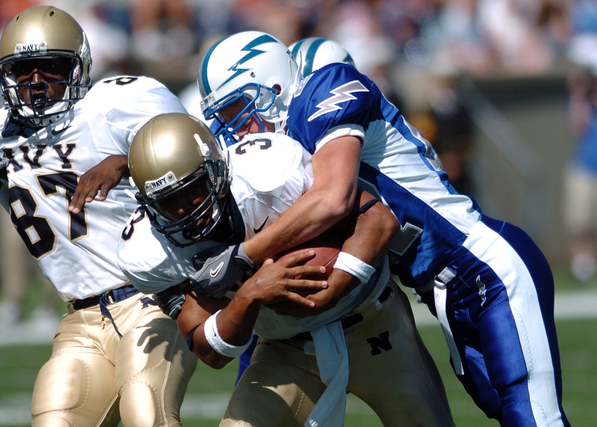 Air Force free safety Trey Eaton catches Navy quarterback Brian Hampton Saturday after an eight-yard gain and Navy first down.  Hampton ran for 111 of Navy’s 329 rushing yards in their 24-17 win over the Falcons.  (Photo by 1st Lt. John Ross)