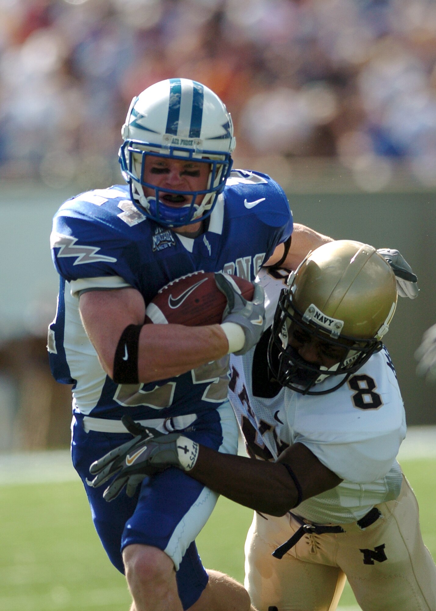 Navy cornerback Jeremy McGown brings down Air Force halfback Chad Smith Saturday just short of the end zone on a second quarter run. Falcon halfback Chad Hall scored a touchdown on the following play, but the Falcons came up short in the end, 17-24. (Photo by 1st Lt. John Ross)